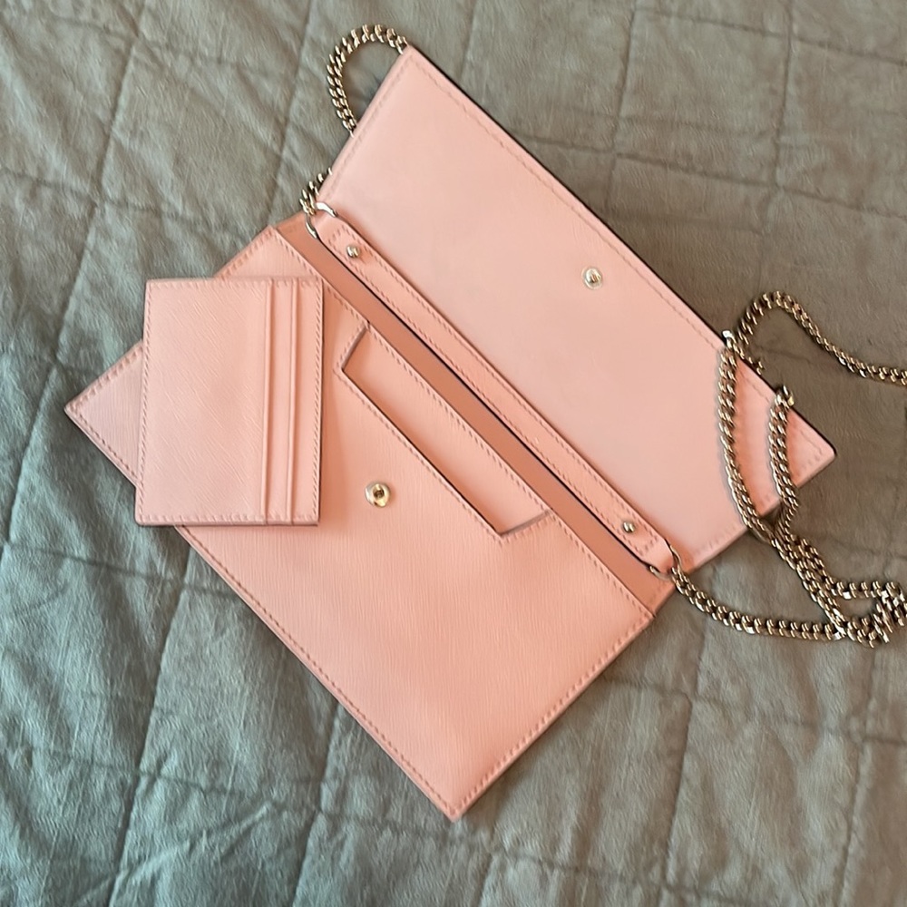 Kate Spade purse in light pink. Never used. Like new.